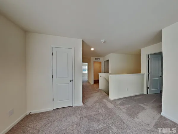 a view of a livingroom with furniture and a ceiling fan