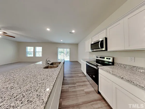 a large kitchen with cabinets