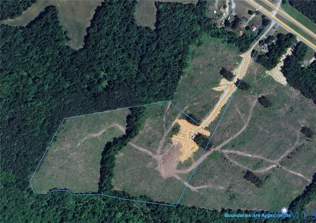 an aerial view of a house with outdoor space