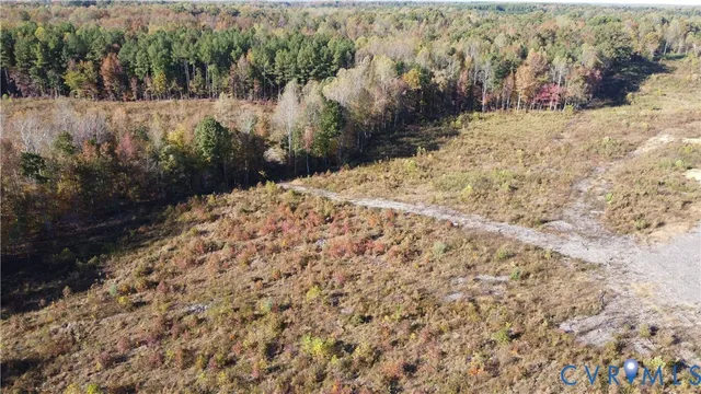 a view of a yard covered with snow in front of house