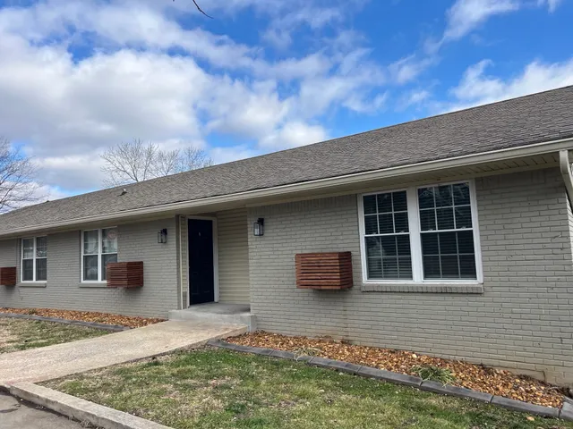a house view with a backyard space