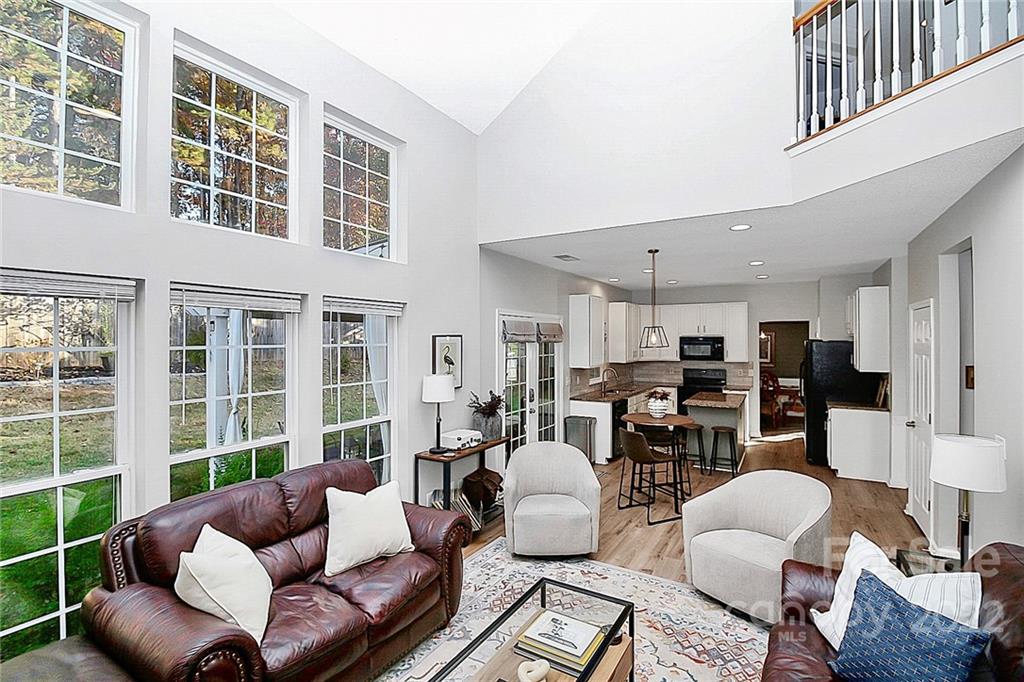 12403 Old Timber Road Charlotte, NC 28269 - Photo 13 of 33 a living room with furniture and a large window