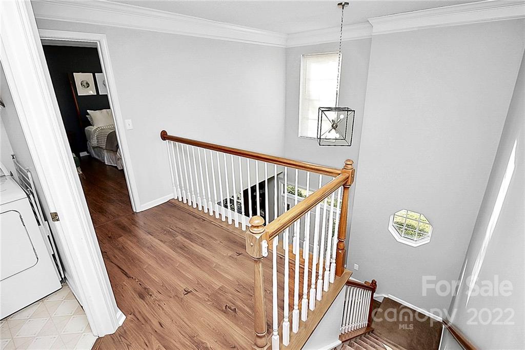 12403 Old Timber Road Charlotte, NC 28269 - Photo 15 of 33 a view of entryway with stairs and wooden floor