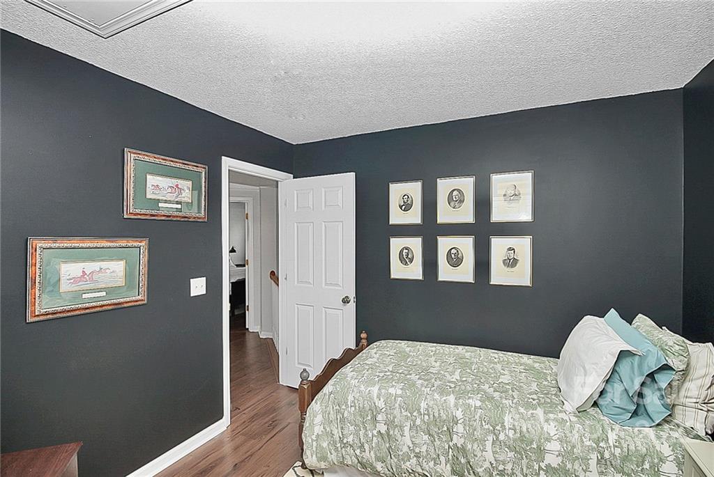 12403 Old Timber Road Charlotte, NC 28269 - Photo 20 of 33 a bedroom with a bed and a window