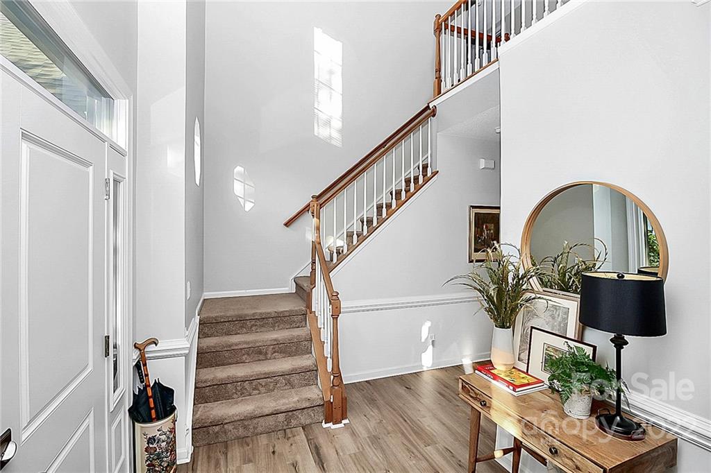 12403 Old Timber Road Charlotte, NC 28269 - Photo 2 of 33 a view of entryway and hall with wooden floor