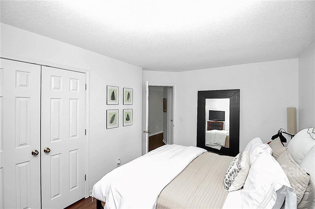 12403 Old Timber Road Charlotte, NC 28269 - Photo 23 of 33 a bedroom with a bed and a window