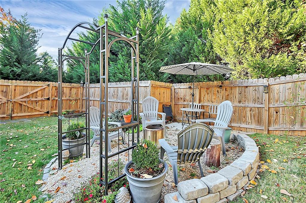 12403 Old Timber Road Charlotte, NC 28269 - Photo 26 of 33 a view of a chair and table in backyard