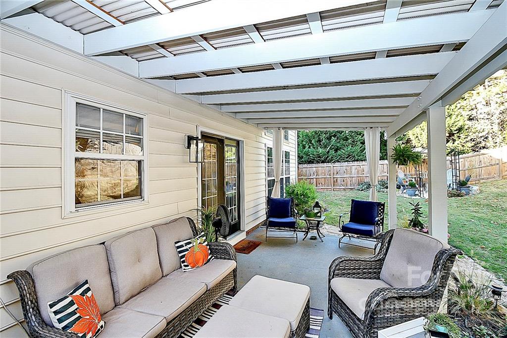 12403 Old Timber Road Charlotte, NC 28269 - Photo 30 of 33 a outdoor living space with furniture and garden view