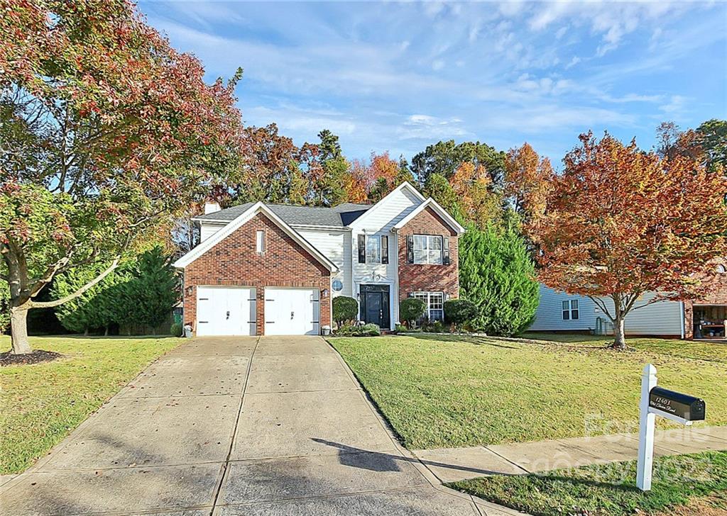 12403 Old Timber Road Charlotte, NC 28269 - Photo 33 of 33 a front view of a house with a yard