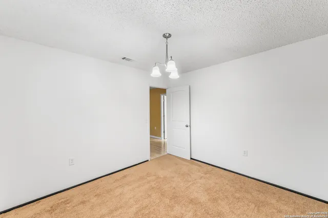 a view of a windows and chandelier in a room