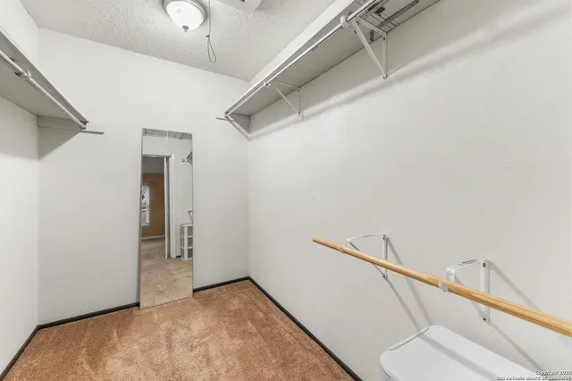 a view of a hallway with closet