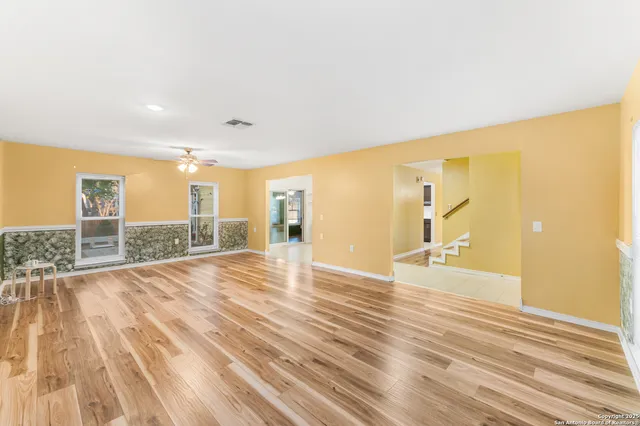 a view of a livingroom with wooden floor
