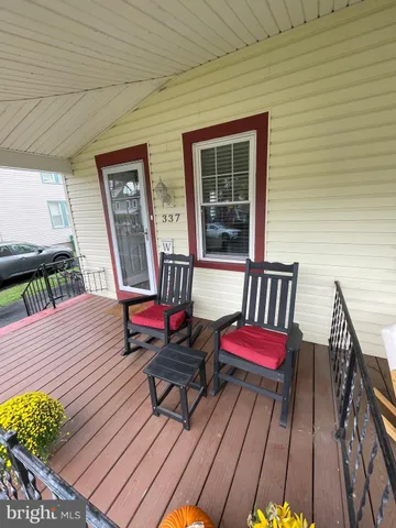 a view of outdoor seating space with wooden floor