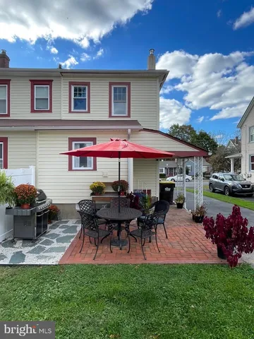 a group of people sitting in front of a building