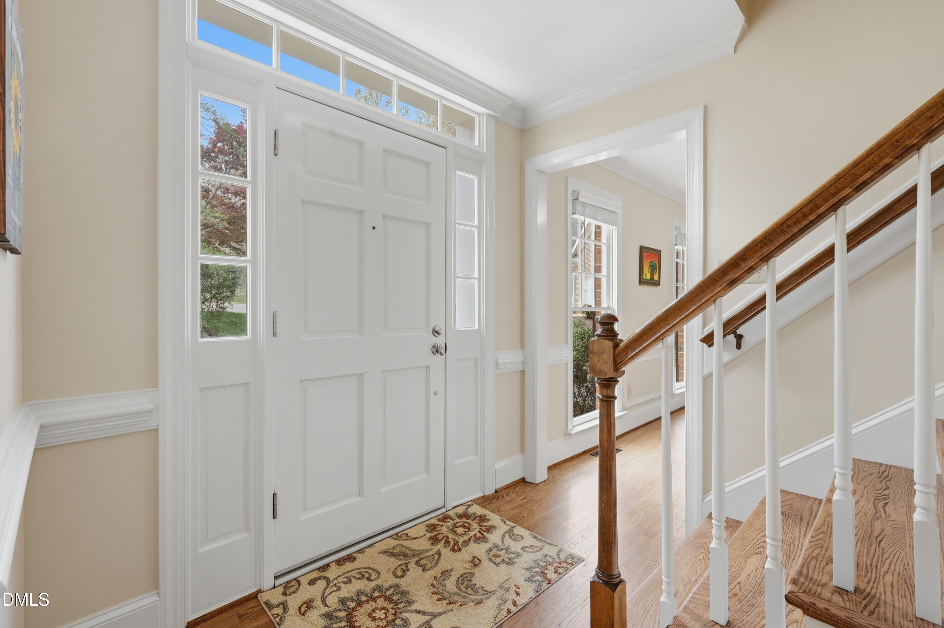 4001 Stemmons Court Raleigh, NC 27613 - Photo 5 of 45 a view of entryway with wooden floor and stairs