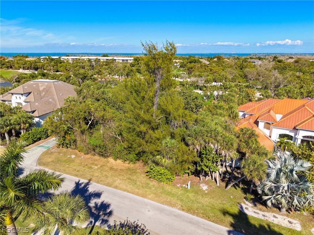 2486 Wulfert Road Sanibel, FL 33957 - Photo 24 of 26 a view of a lake with a yard