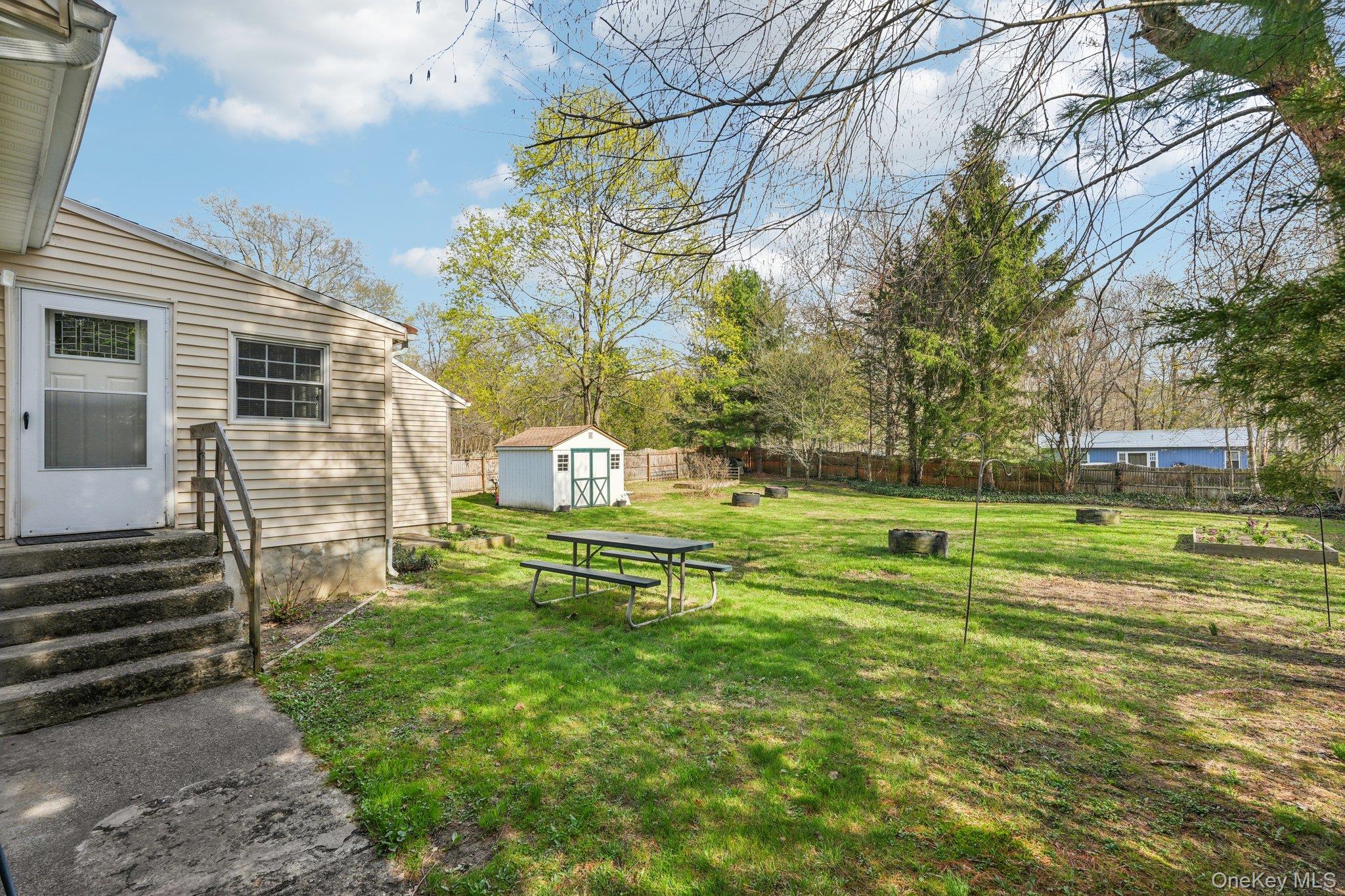 40 Widmer Road Wappingers Falls, NY 12590 - Photo 34 of 44 Fully fenced backyard with storage shed