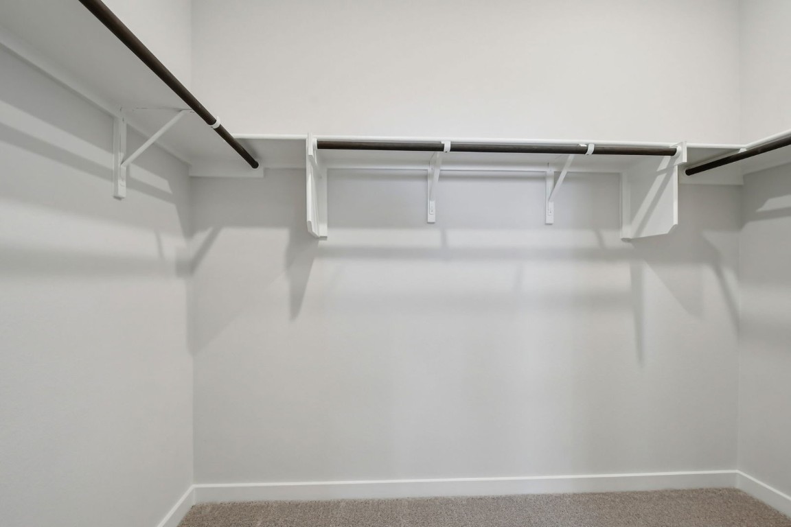 13419 Derby Ride Drive Buda, TX 78610 - Photo 15 of 29 a view of small space with racks on the wall