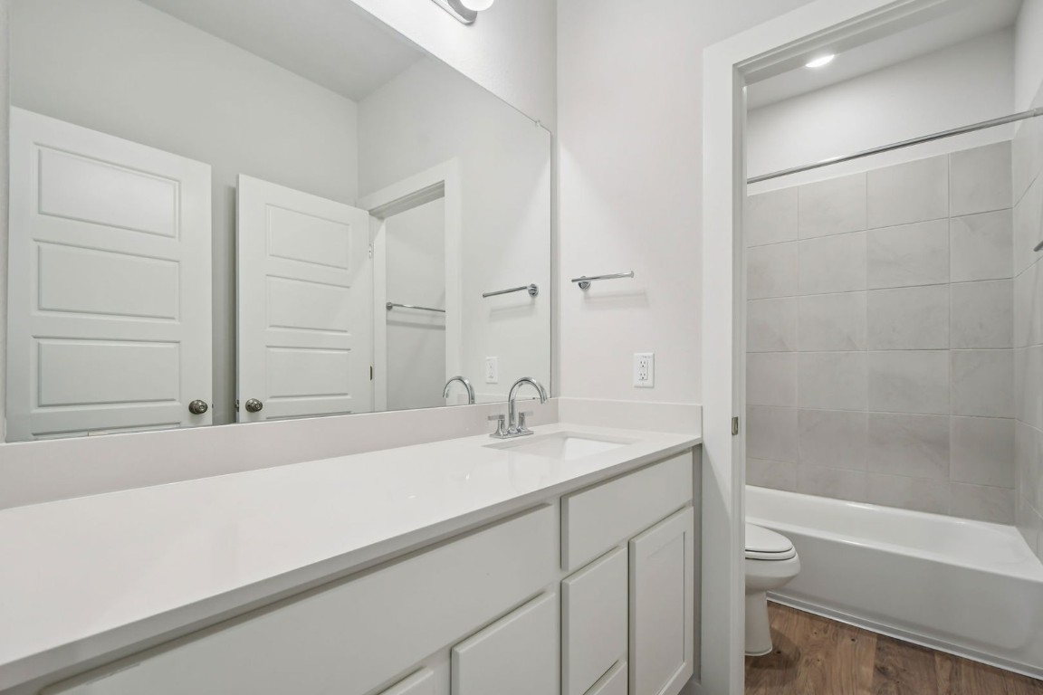 13419 Derby Ride Drive Buda, TX 78610 - Photo 18 of 29 a bathroom with a sink and a bathtub