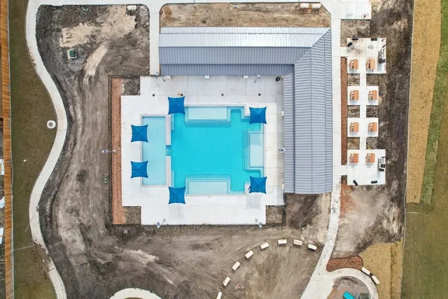 a view of swimming pool with a yard