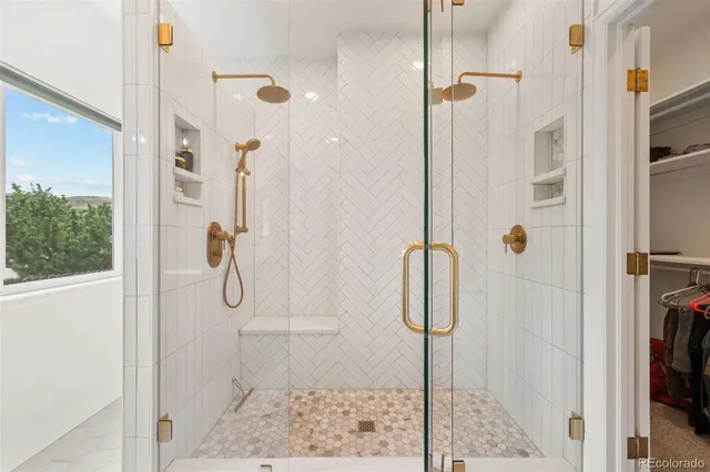 a living room with furniture fireplace and a large window