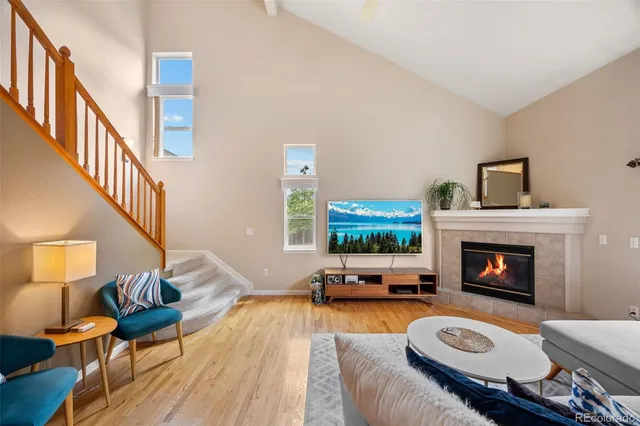 a living room with furniture and a dining table