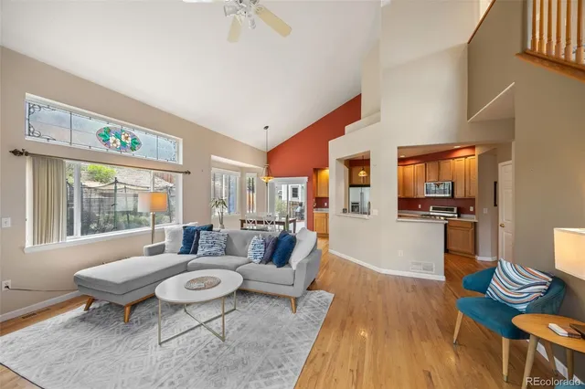 a view of a dining room with furniture wooden floor and a chandelier