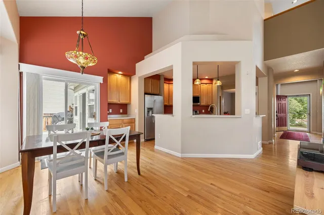 a kitchen with stainless steel appliances granite countertop a stove refrigerator and a microwave oven