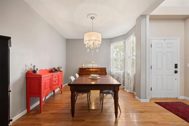 a room with a chair and wooden floor