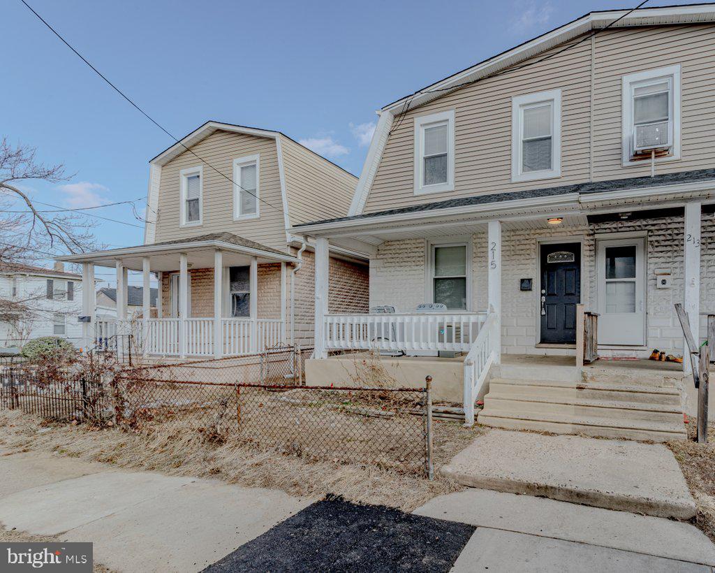 215 North Fairview Street Riverside, NJ 08075 - Photo 1 of 25 a front view of a house with iron stairs
