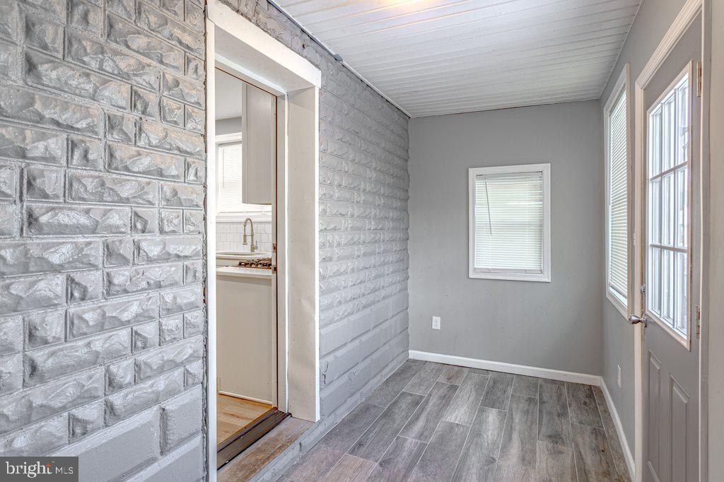 215 North Fairview Street Riverside, NJ 08075 - Photo 15 of 25 a view of a hallway with wooden floor and a window