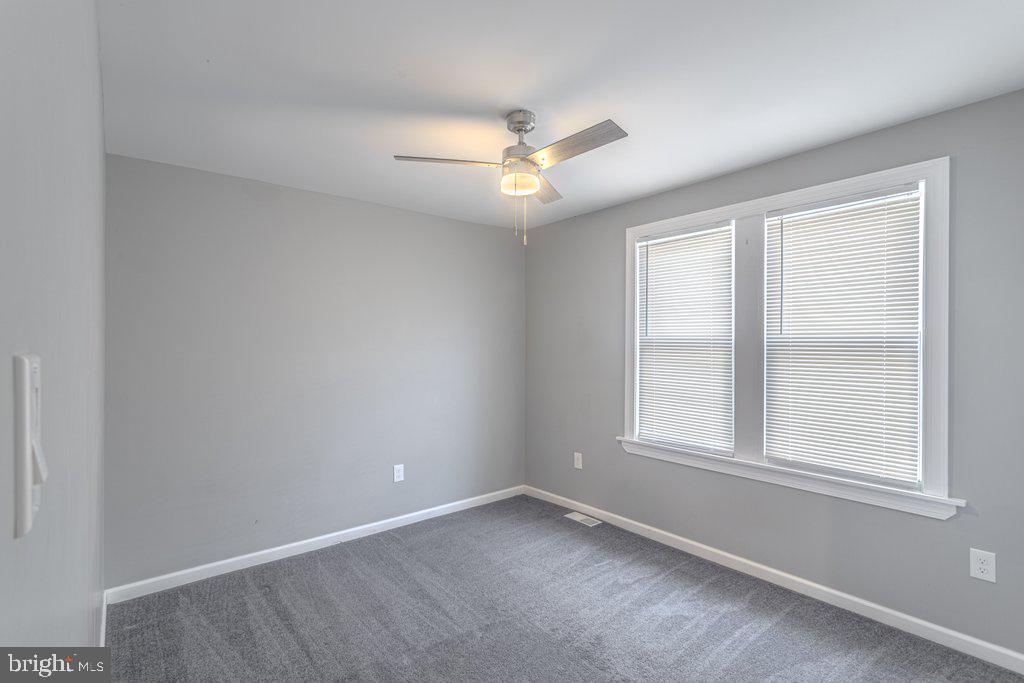 215 North Fairview Street Riverside, NJ 08075 - Photo 18 of 25 an empty room with a window and a fan