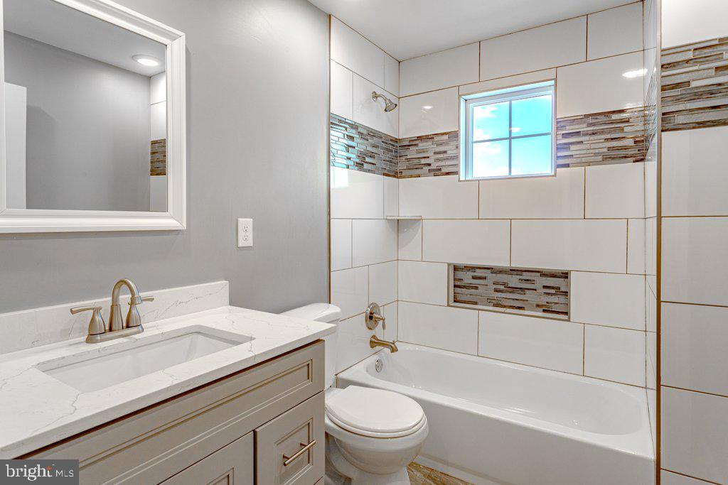 215 North Fairview Street Riverside, NJ 08075 - Photo 20 of 25 a bathroom with a sink a toilet and shower