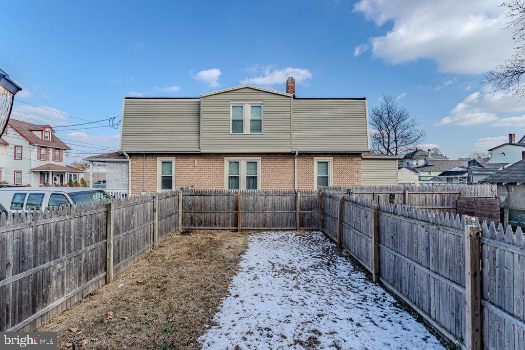 215 North Fairview Street Riverside, NJ 08075 - Photo 24 of 25 a front view of a house with a wooden fence