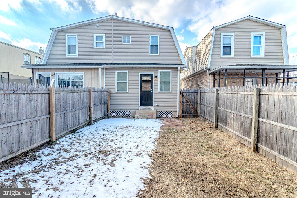215 North Fairview Street Riverside, NJ 08075 - Photo 25 of 25 a front view of a house with a wooden fence