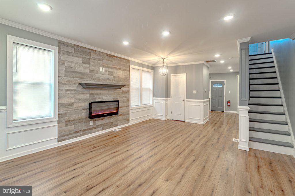 215 North Fairview Street Riverside, NJ 08075 - Photo 4 of 25 wooden floor in an empty room with a fireplace and wooden floor