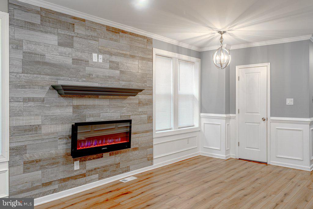 215 North Fairview Street Riverside, NJ 08075 - Photo 5 of 25 wooden floor fireplace and windows in an empty room