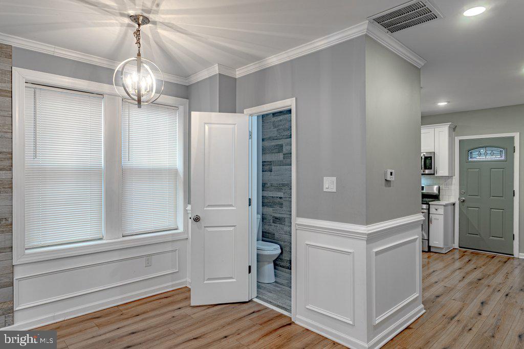 215 North Fairview Street Riverside, NJ 08075 - Photo 6 of 25 wooden floor in an empty room with a kitchen