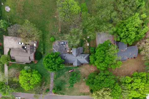 an aerial view of a house with outdoor space and street view