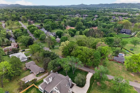 an aerial view of residential house with outdoor space and mountain view