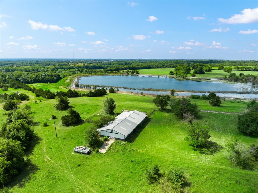 318 Cold Springs Road Van Alstyne, TX 75495 - Photo 6 of 17 a view of a lake with a big yard