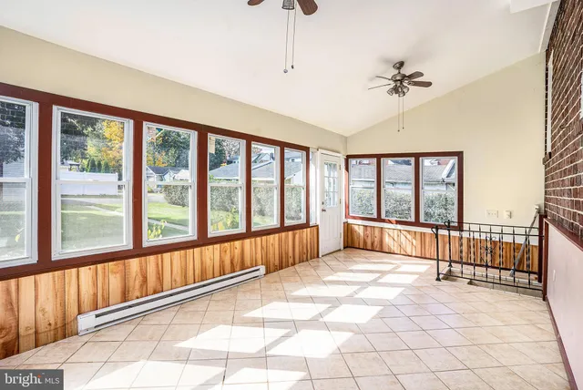 a spacious bedroom with a large bed and a large window