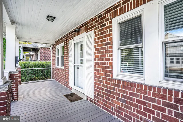 a view of outdoor space with deck and furniture