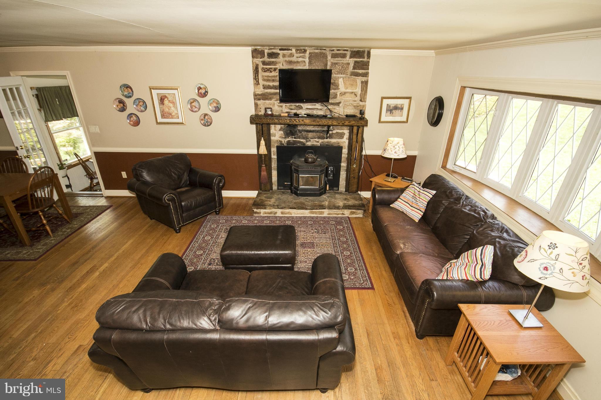 6718 Glenkirk Road Baltimore, MD 21239 - Photo 3 of 30 Living Room with Hardwoods & Pellet FP!