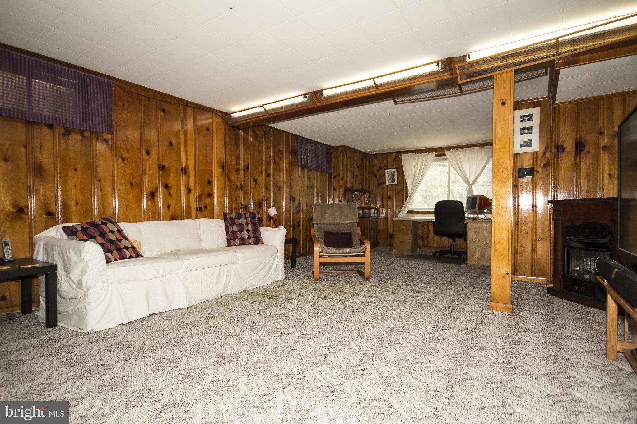 6718 Glenkirk Road Baltimore, MD 21239 - Photo 23 of 30 Knotty Pine Club Room with Gas Fireplace!