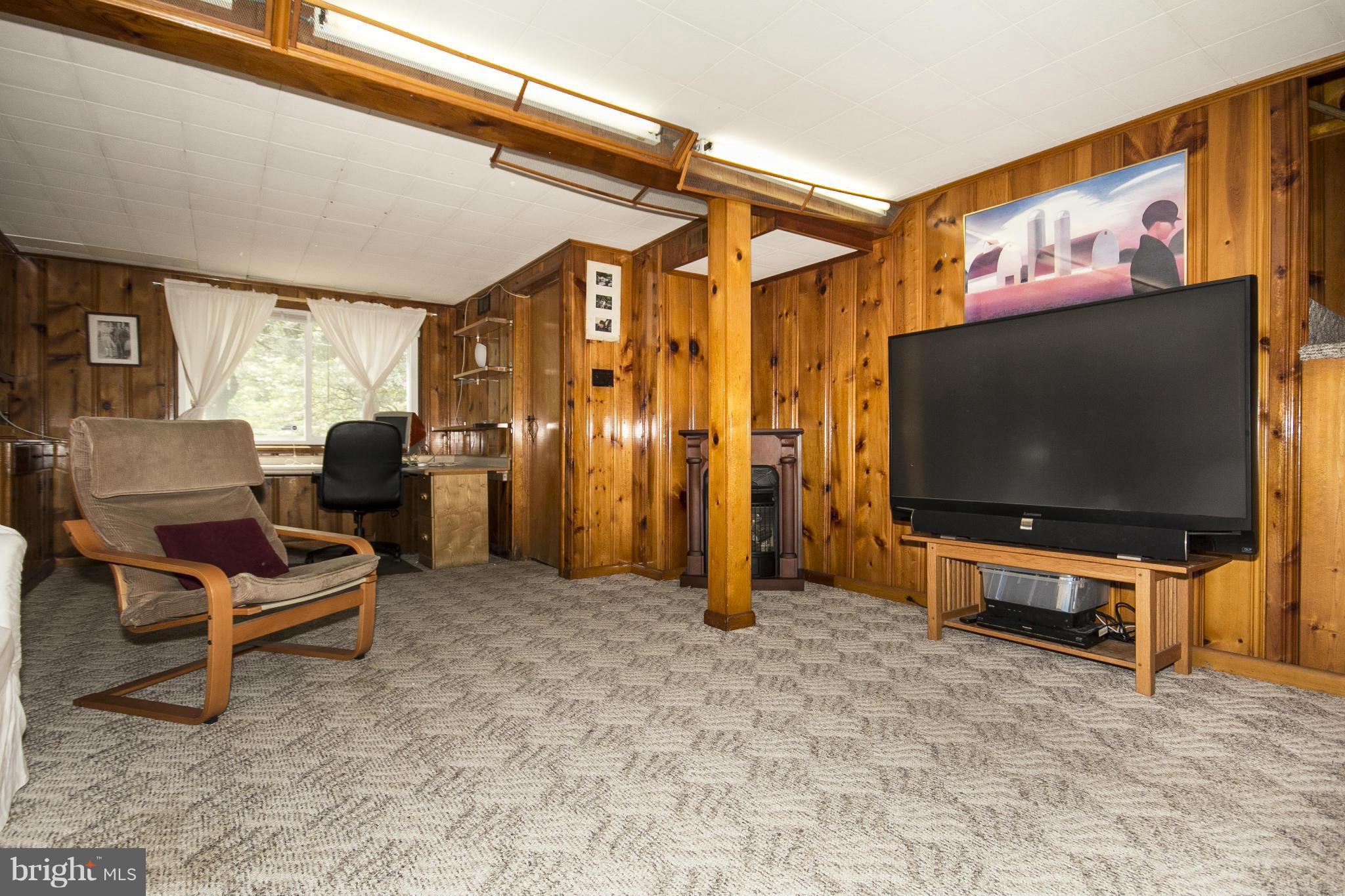 6718 Glenkirk Road Baltimore, MD 21239 - Photo 24 of 30 Knotty Pine Club Room with Gas Fireplace!