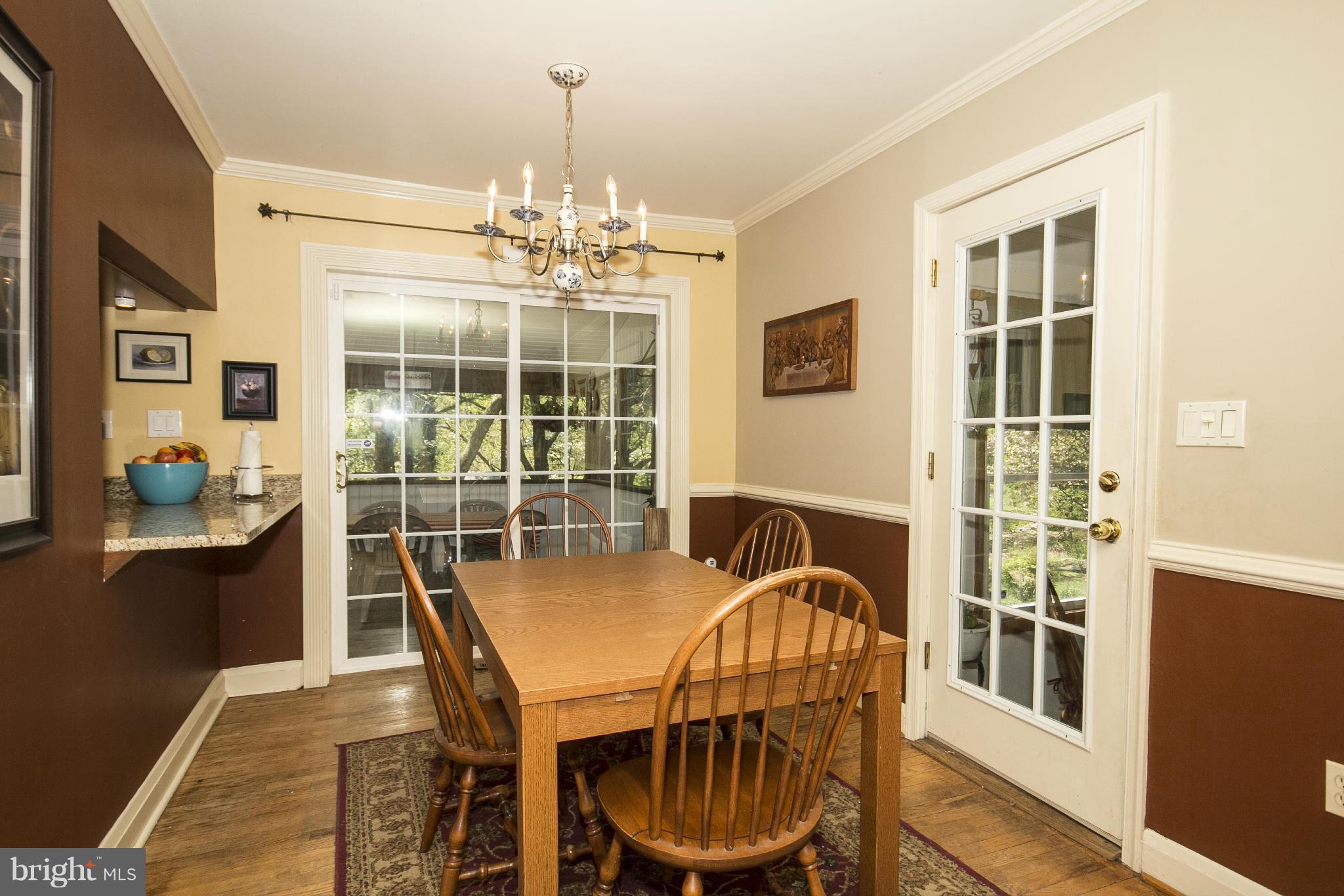 6718 Glenkirk Road Baltimore, MD 21239 - Photo 8 of 30 Dining Room leads to Screened Porch!
