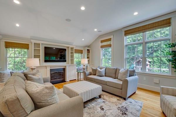 24 Birch Road Wellesley, MA 02482 - Photo 20 of 39 a living room with furniture a large window and a flat screen tv