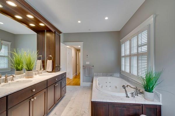 24 Birch Road Wellesley, MA 02482 - Photo 23 of 39 a spacious bathroom with a double vanity sink and a large mirror