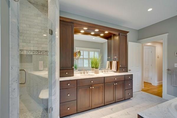 24 Birch Road Wellesley, MA 02482 - Photo 24 of 39 a bathroom with a double vanity sink and mirror with shower